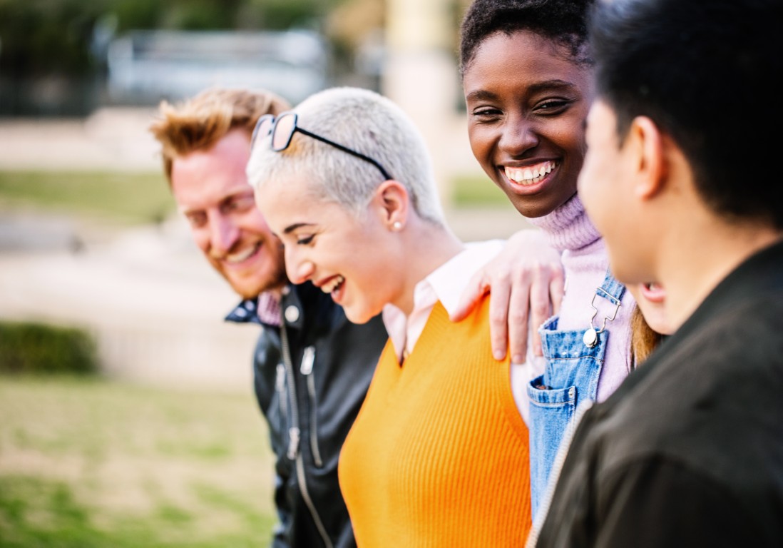 Diverse group of young people having fun together outdoor